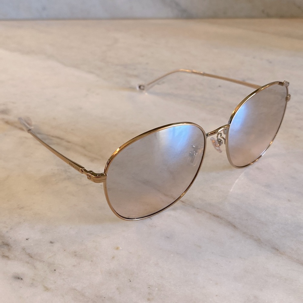 Coach sunglasses rose gold metal frame.
